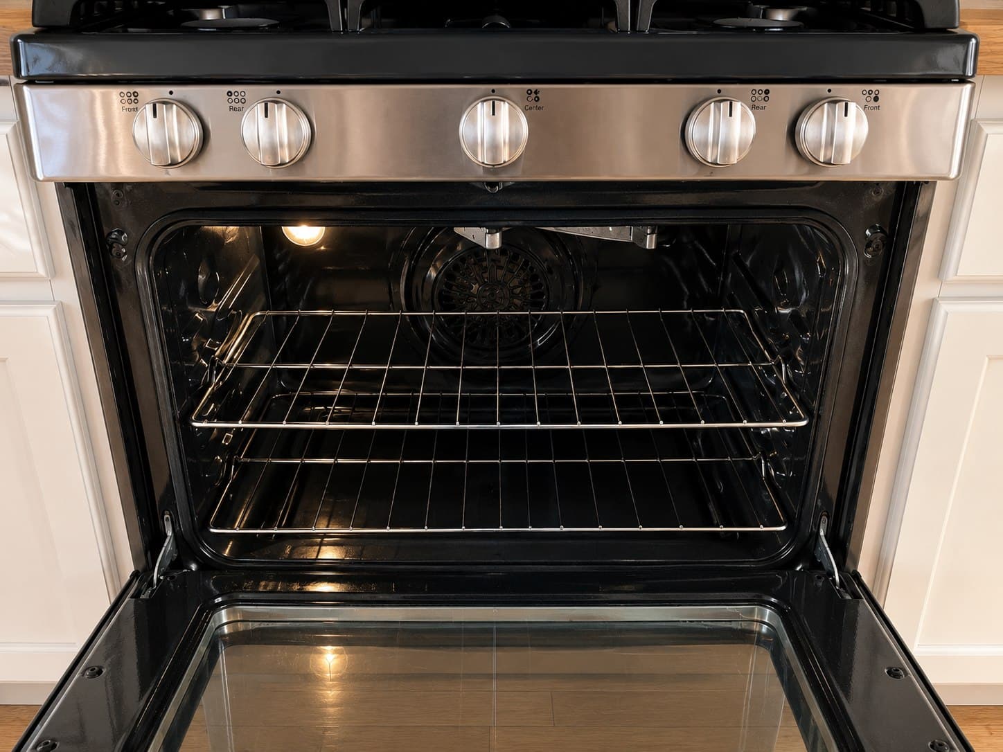 The same oven interior after a ShinySpaces deep cleaning, spotless and free of residue